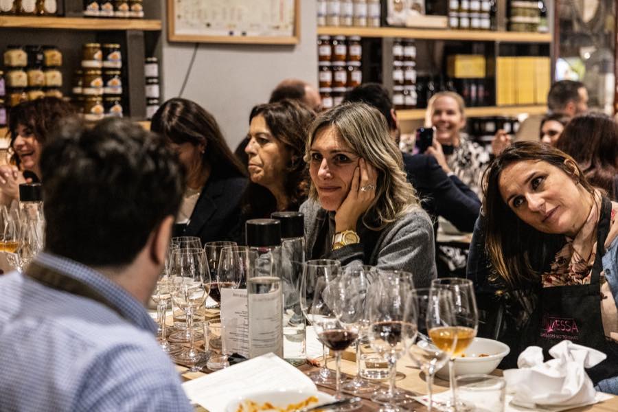 Guests sitting down together to eat with wine